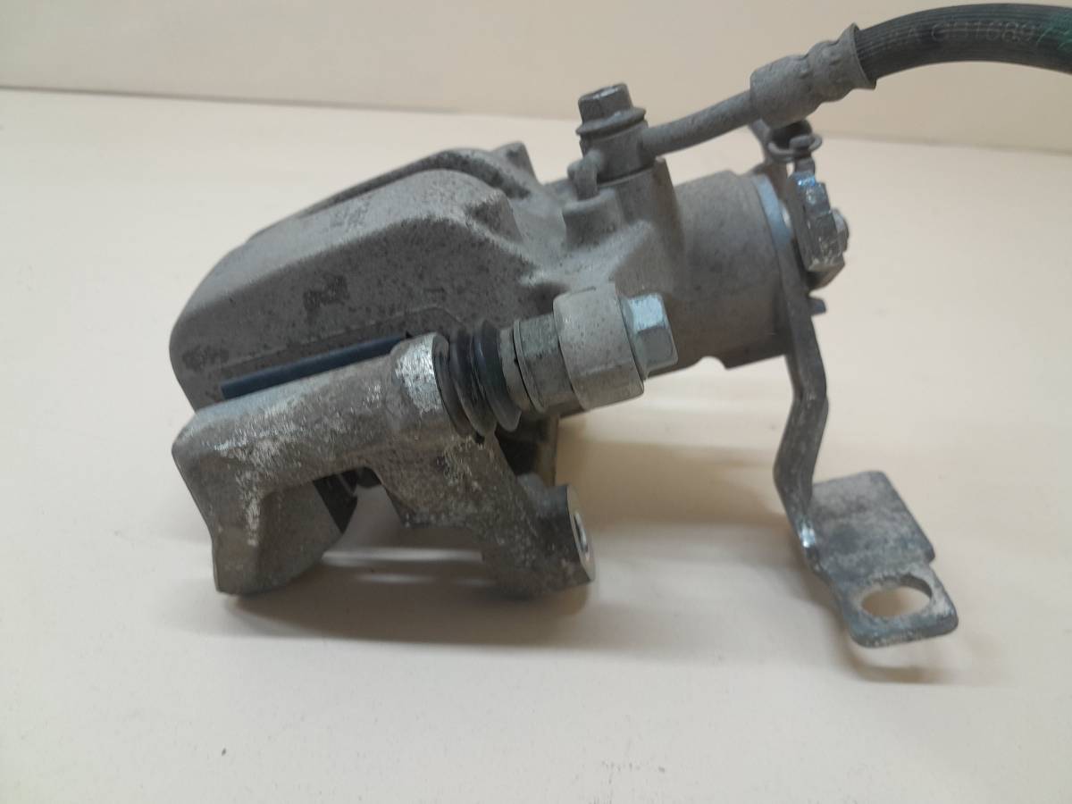 Суппорт задний левый Kia K5 (DL3) 2019>