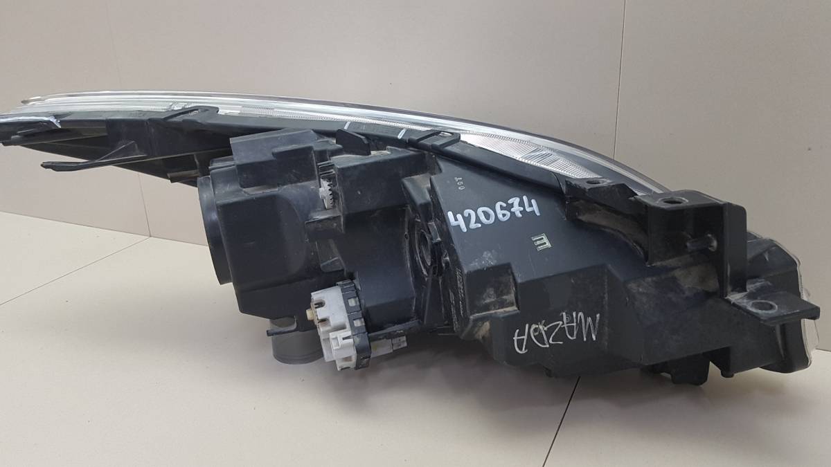 Фара левая Mazda Mazda 3 (BL) 2009-2013
