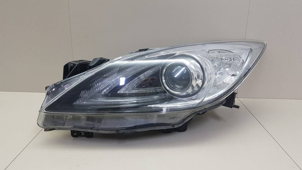 Фара левая Mazda Mazda 3 (BL) 2009-2013