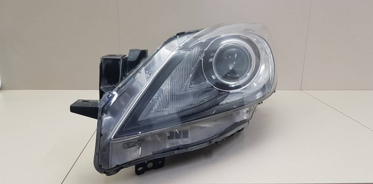 Фара левая Mazda Mazda 3 (BL) 2009-2013