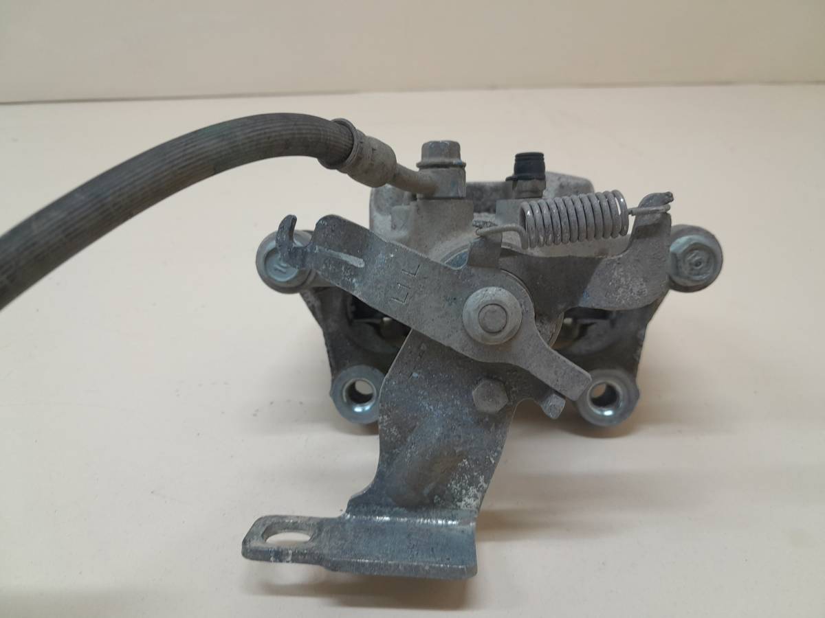 Суппорт задний левый Kia K5 (DL3) 2019>