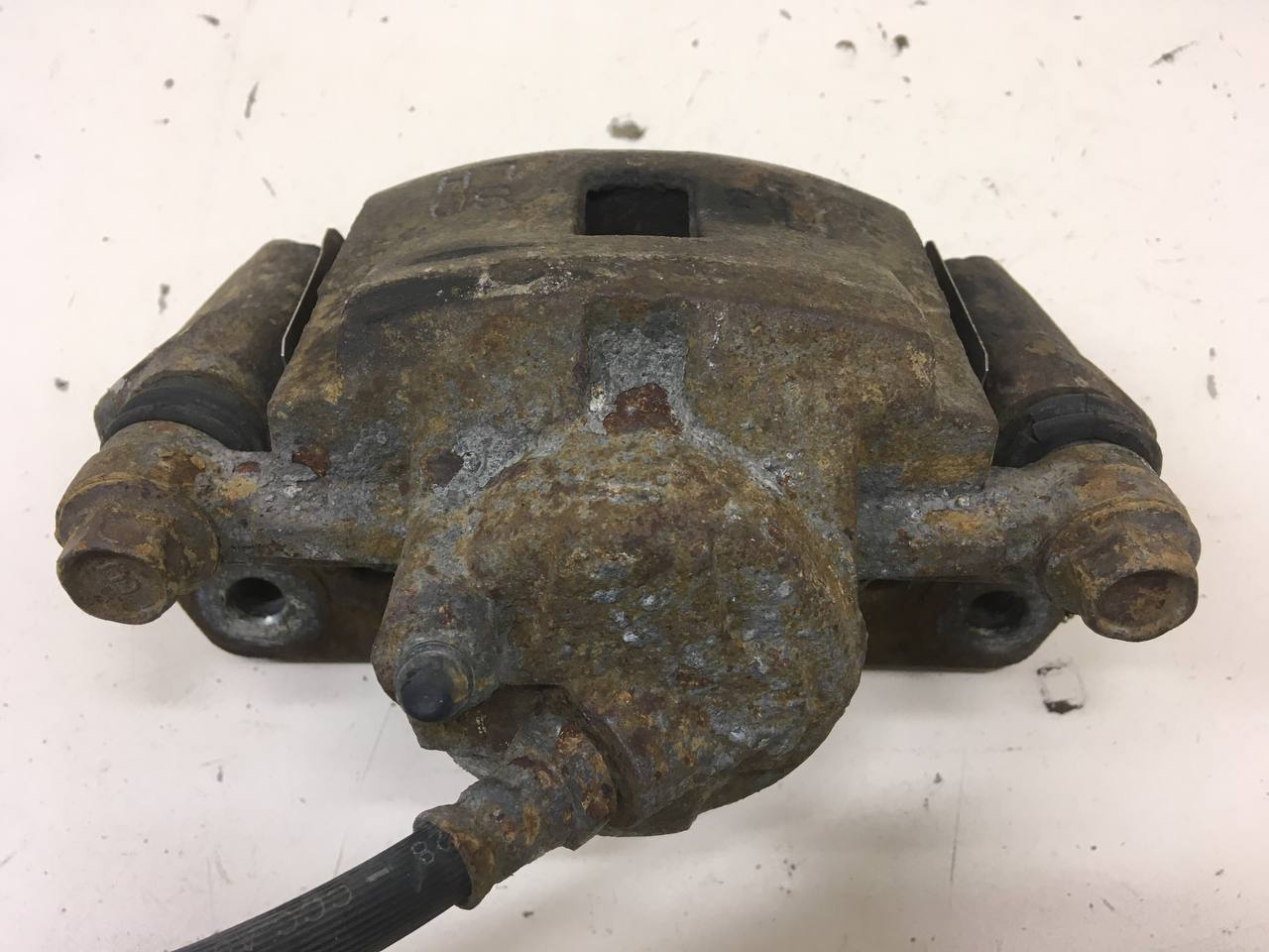 Суппорт передний левый Kia Spectra (SD) 2004-2011