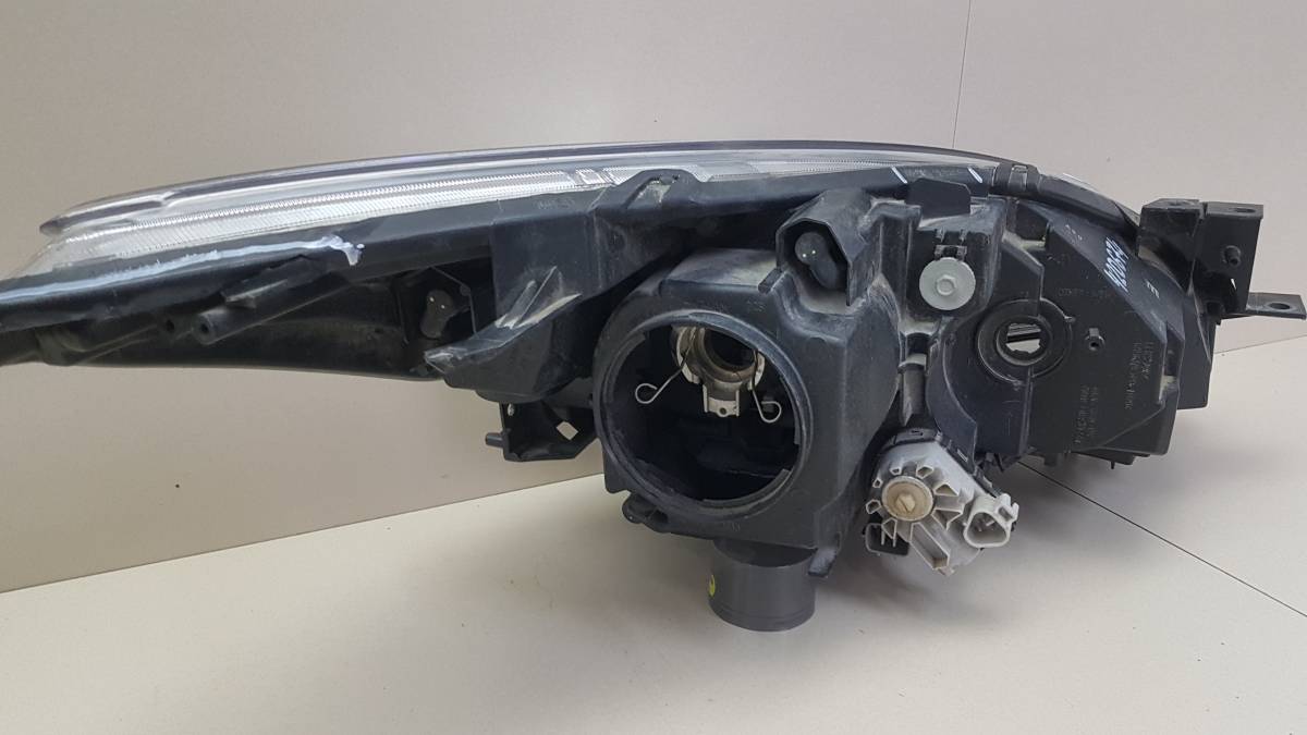 Фара левая Mazda Mazda 3 (BL) 2009-2013